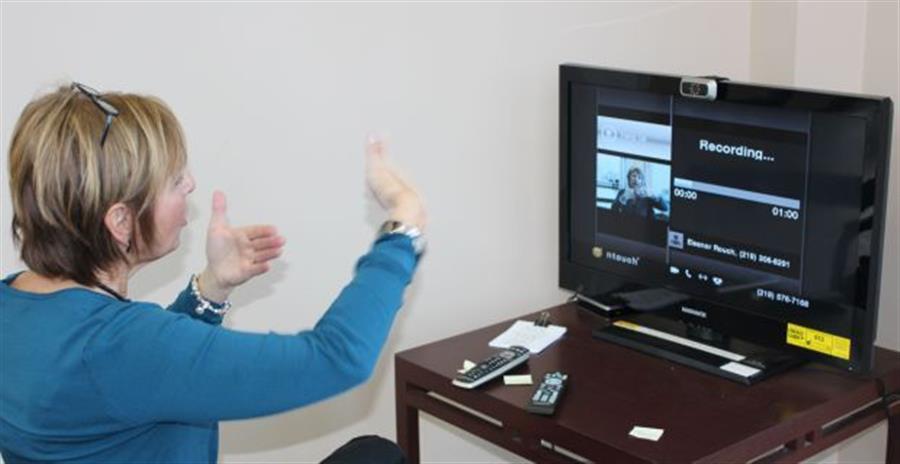Someone communicating via video relay.